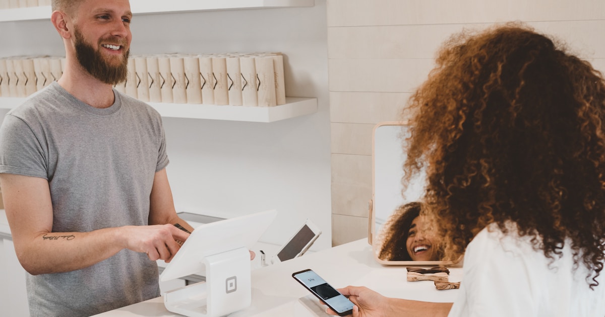 Customer checking out on an online store with payment terminal