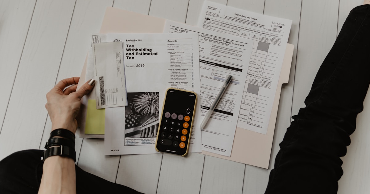 Business owner reviewing website maintenance and budget documents